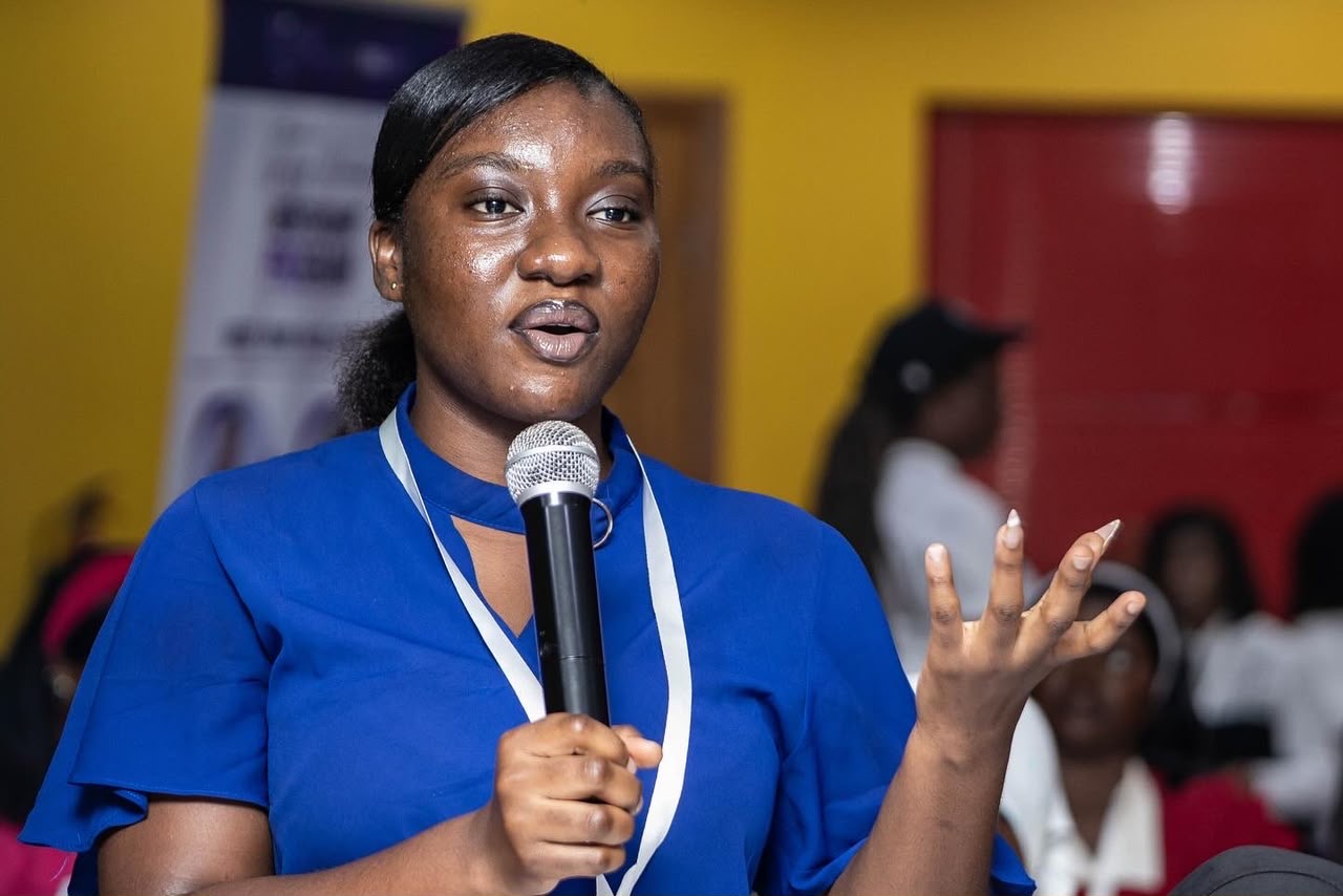 Cohort 1 participant speaking at the microphone